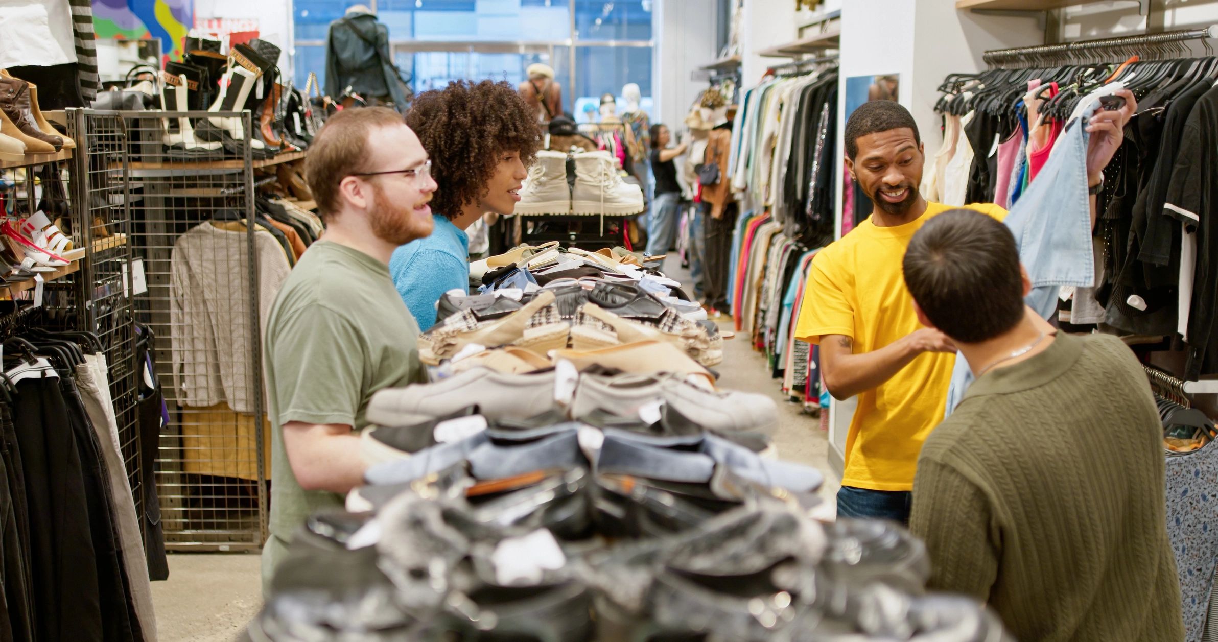 Shoppers browsing clothing together in a stylish boutique