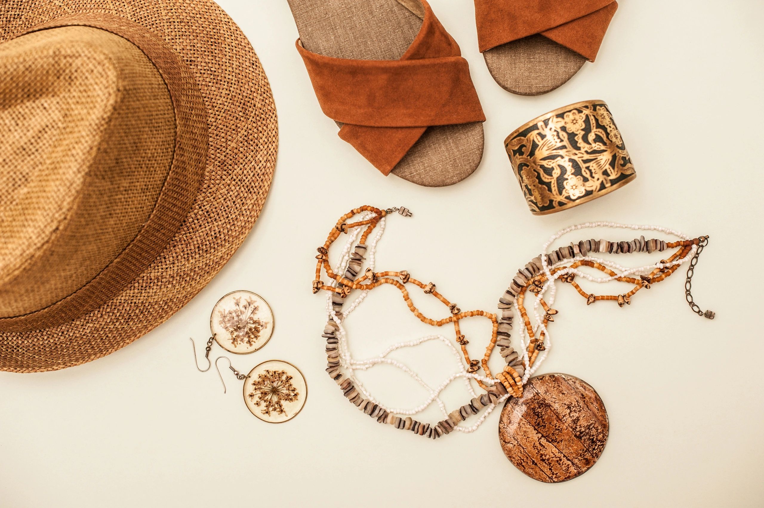 Fashion accessories arranged in a boutique-inspired flat lay